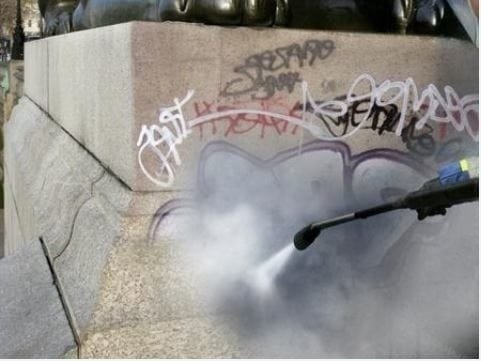 power washing graffiti off curb